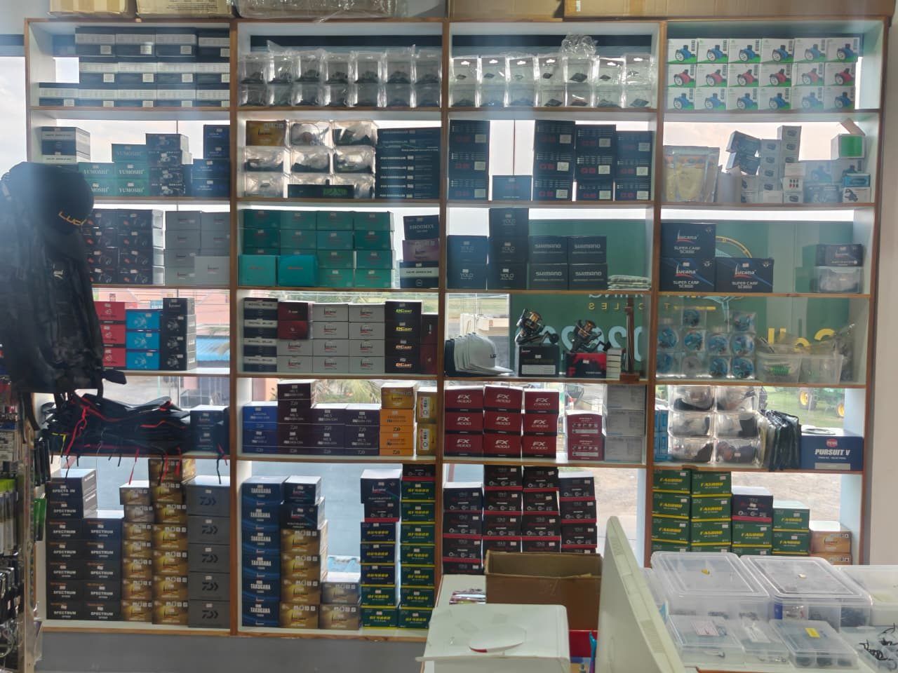 Shop shelving stacked with boxed tackle